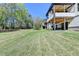 Spacious backyard with a lush lawn and a view of the home's covered patios at 2255 Buford Dam Rd, Buford, GA 30518