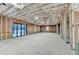 Unfinished basement with exposed framing and a sliding glass door to the backyard at 2255 Buford Dam Rd, Buford, GA 30518