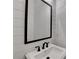 Modern bathroom featuring a stylish mirror, white basin sink, and sleek black fixtures at 2255 Buford Dam Rd, Buford, GA 30518
