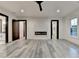 Bright bedroom with a fireplace, sleek flooring, and modern trim at 2255 Buford Dam Rd, Buford, GA 30518