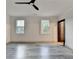 Bright bedroom with two windows and modern ceiling fan, spacious and well-lit at 2255 Buford Dam Rd, Buford, GA 30518