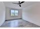 Bedroom with great light from the window and light color wall and flooring at 2255 Buford Dam Rd, Buford, GA 30518