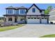 Charming two-story home with a three-car garage, covered porch, and professionally landscaped front yard at 2255 Buford Dam Rd, Buford, GA 30518