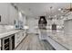 Elegant kitchen with white cabinets, black hardware, marble countertops, and stainless appliances at 2255 Buford Dam Rd, Buford, GA 30518