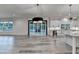 Open floor plan featuring a kitchen island, stainless appliances, and a sliding glass door at 2255 Buford Dam Rd, Buford, GA 30518