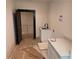 Laundry room with white cabinets, black hardware, and a speckled countertop at 2255 Buford Dam Rd, Buford, GA 30518