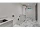 Well-lit laundry room with elegant marbled floors and white cabinetry at 2255 Buford Dam Rd, Buford, GA 30518