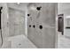 Large walk-in shower with multiple shower heads and modern tile design at 2255 Buford Dam Rd, Buford, GA 30518
