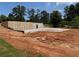 New basement foundation featuring waterproof coating, perimeter drains and gravel backfill at 2257 Buford Dam Rd, Buford, GA 30518