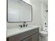 Modern bathroom featuring a sleek vanity with quartz countertop and elegant black fixtures at 76 Telfair Ct, Acworth, GA 30101