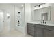 Well-lit bathroom featuring a vanity with drawers, bathtub and shower with white tile at 76 Telfair Ct, Acworth, GA 30101