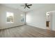 Bright bedroom with two windows, ceiling fan, and neutral walls at 76 Telfair Ct, Acworth, GA 30101