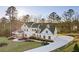 Gorgeous home exterior with lush landscaping and circular driveway at 76 Telfair Ct, Acworth, GA 30101