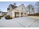 Three car garage with carriage doors and additional parking pad at 76 Telfair Ct, Acworth, GA 30101