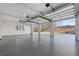 Spacious three car garage with epoxy floor and overhead door openers at 76 Telfair Ct, Acworth, GA 30101