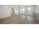 Open-concept living area featuring hardwood floors and natural light from large windows at 76 Telfair Ct, Acworth, GA 30101
