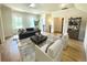Living room featuring a modern couch and chairs with decor, natural light and wood flooring at 76 Telfair Ct, Acworth, GA 30101