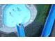Aerial shot of a vibrant pool with multiple slides and swimmers enjoying a sunny day at 76 Telfair Ct, Acworth, GA 30101