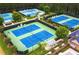 Aerial view of community tennis courts surrounded by lush greenery and landscaping at 76 Telfair Ct, Acworth, GA 30101
