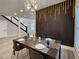 Dining area featuring contemporary decor, stylish lighting, and a unique accent wall for a modern touch at 1089 White Oak Sw Ave, Atlanta, GA 30310