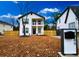 Charming two-story home with a welcoming front porch and manicured lawn, perfect for curb appeal at 1089 White Oak Sw Ave, Atlanta, GA 30310