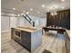 Modern kitchen featuring an island with bar seating and stainless steel appliances, perfect for entertaining at 1089 White Oak Sw Ave, Atlanta, GA 30310