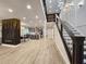 Bright, open-concept living space with modern lighting, sleek floors, and a stylish kitchen in view at 1089 White Oak Sw Ave, Atlanta, GA 30310