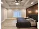 Spacious main bedroom boasts tray ceiling, modern accent wall, and large window for natural light at 1089 White Oak Sw Ave, Atlanta, GA 30310