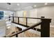 Bright foyer featuring staircase with unique white rope railing and view of the lower level at 1089 White Oak Sw Ave, Atlanta, GA 30310