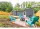 Private backyard with patio, fire pit, and view of house at 1699 Olympian Sw Way, Atlanta, GA 30310