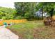Large backyard with grassy area and wooden fence at 1699 Olympian Sw Way, Atlanta, GA 30310