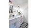 Double vanity bathroom with white cabinets and quartz countertops at 1699 Olympian Sw Way, Atlanta, GA 30310