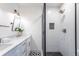 Clean bathroom with white tile, double vanity, and black shower at 1699 Olympian Sw Way, Atlanta, GA 30310