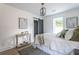 Bright bedroom with window, barn door, and ensuite bathroom at 1699 Olympian Sw Way, Atlanta, GA 30310