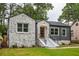Updated home exterior, featuring stone and gray siding at 1699 Olympian Sw Way, Atlanta, GA 30310