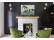 Contemporary fireplace with a white tile surround and wood mantel at 1699 Olympian Sw Way, Atlanta, GA 30310