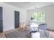Spacious home office with hardwood floors and ample natural light at 1699 Olympian Sw Way, Atlanta, GA 30310