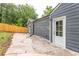 Gray house exterior with white door and backyard patio at 1699 Olympian Sw Way, Atlanta, GA 30310
