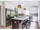 Modern kitchen with stainless steel appliances, granite island, and white shaker cabinets at 1699 Olympian Sw Way, Atlanta, GA 30310