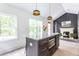 Modern kitchen with island, stainless steel appliances, and white cabinets at 1699 Olympian Sw Way, Atlanta, GA 30310