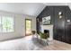 Bright living room features a fireplace, hardwood floors, and stylish seating at 1699 Olympian Sw Way, Atlanta, GA 30310