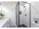 Large walk-in shower with black frame and white tile at 1699 Olympian Sw Way, Atlanta, GA 30310