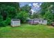 Backyard with a shed, a brick home, a patio, and a wooden deck at 3182 Lake Ave, Atlanta, GA 30354