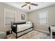 Bedroom showcasing neutral walls, a ceiling fan, and a black metal daybed frame at 3182 Lake Ave, Atlanta, GA 30354