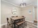 Cozy dining area with rustic furniture, modern lighting, and stylish decor at 3182 Lake Ave, Atlanta, GA 30354
