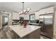 Updated kitchen featuring stainless steel appliances, a center island, and modern lighting fixtures at 3182 Lake Ave, Atlanta, GA 30354