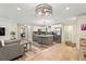 Modern kitchen open to the living area, featuring stainless steel appliances and a large island at 3182 Lake Ave, Atlanta, GA 30354