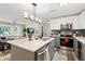 Modern kitchen with island, stainless appliances, and open to the living room, perfect for entertaining at 3182 Lake Ave, Atlanta, GA 30354