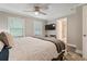 Relaxing main bedroom features plush bedding, ceiling fan, and a large window offering lots of natural light at 3182 Lake Ave, Atlanta, GA 30354