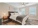 Comfortable main bedroom with a neutral color palette, ceiling fan, and a plush rug at 3182 Lake Ave, Atlanta, GA 30354